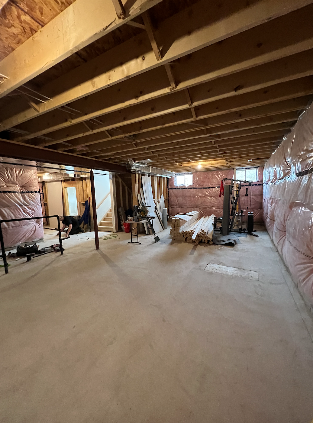 Before picture of unfinished basement in Komoka prior to renovation by Burcon Construction, highlighting the area designated for the living space.