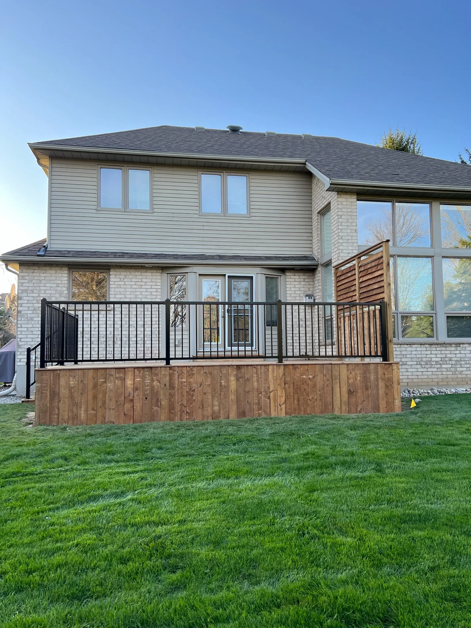 Completed deck in Kilworth by Burcon Construction, providing a stylish and functional outdoor space for relaxation and entertainment.