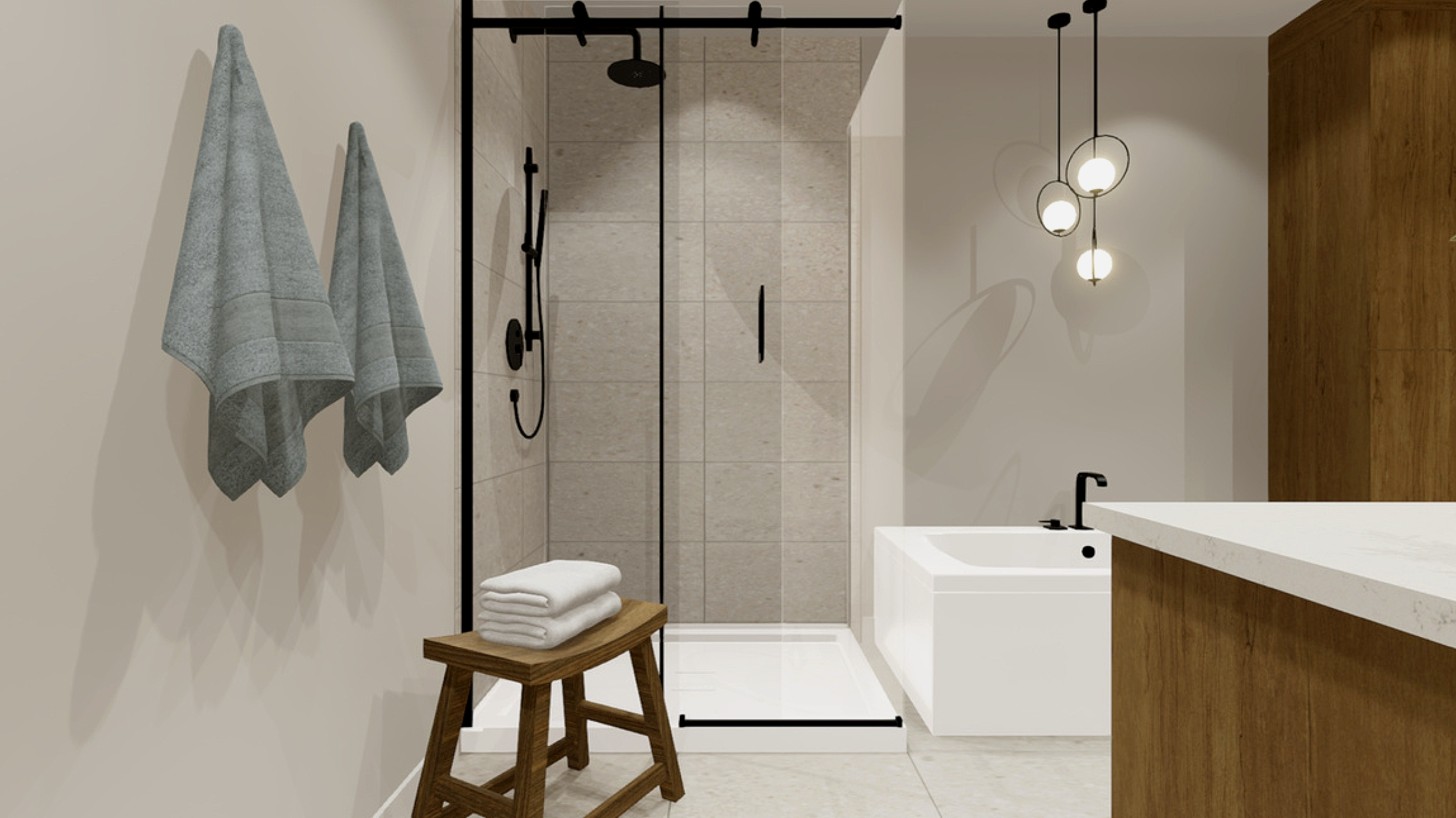 Salle de bain moderne avec douche en verre, baignoire blanche, meubles en bois, deux serviettes grises accrochées au mur, éclairage suspendu avec trois globes lumineux.