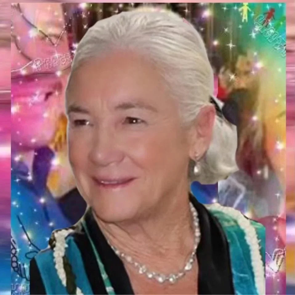 An elderly woman with white hair styled gracefully, wearing a pearl necklace and earrings, smiling softly. The background is colorful with sparkling effects, themed with a festive or holiday mood.