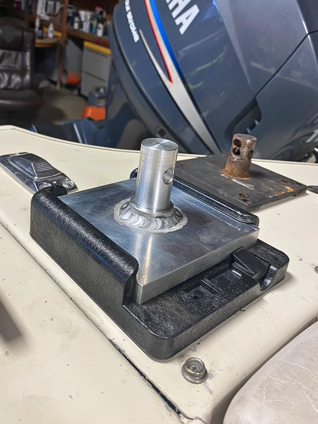 Custom aluminum downrigger mount bracket manufactured for a boat downrigger installation.