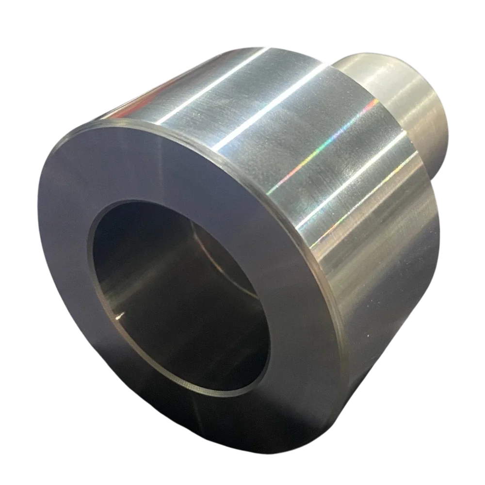 A shiny, metallic, cylindrical roller with a hollow center, possibly a steel or aluminum industrial roller or bearing component.