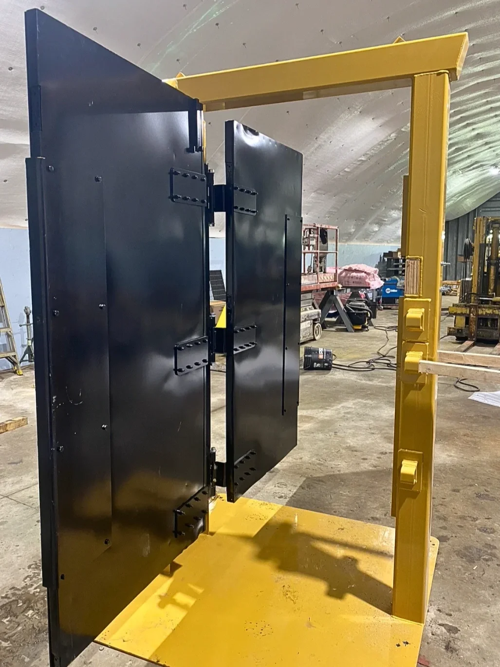 Custom-machined components for a firefighter forced entry training door training system.