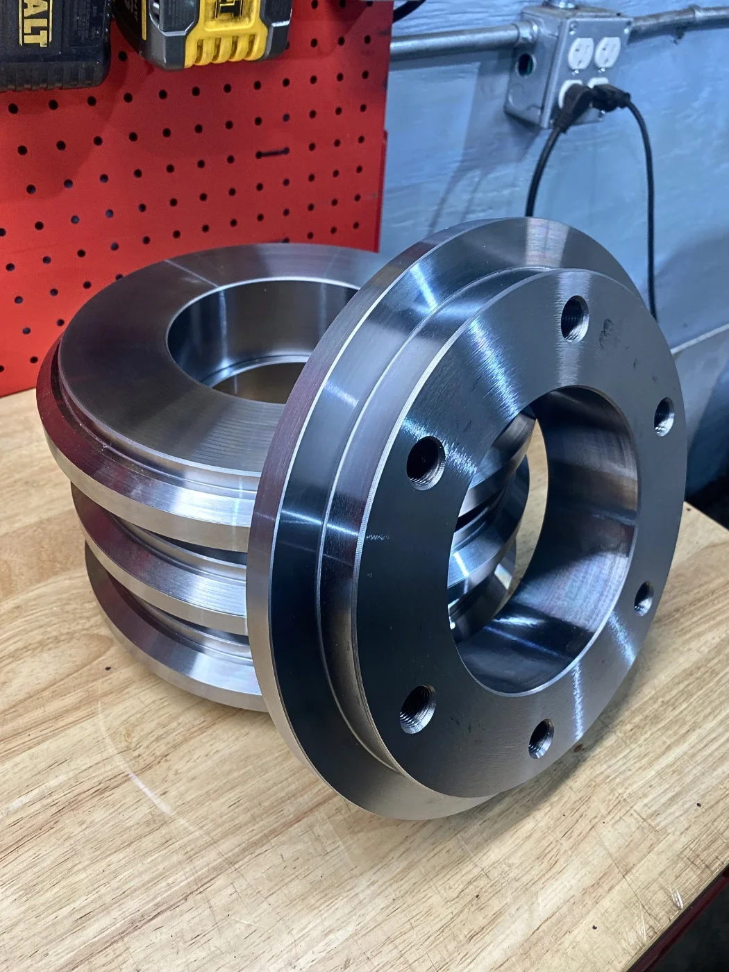 Custom prehardened 4140 steel bolt rings manufactured for hydraulic ram repair and industrial equipment.