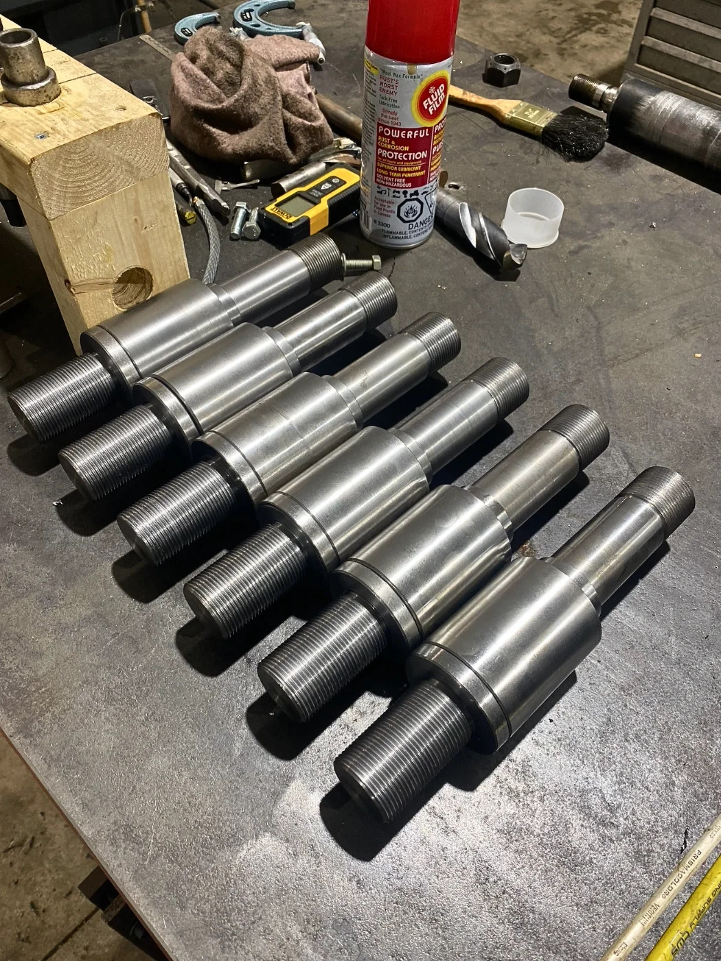 Custom-machined 1018 steel spring retaining bushing and pin assembly for industrial applications.