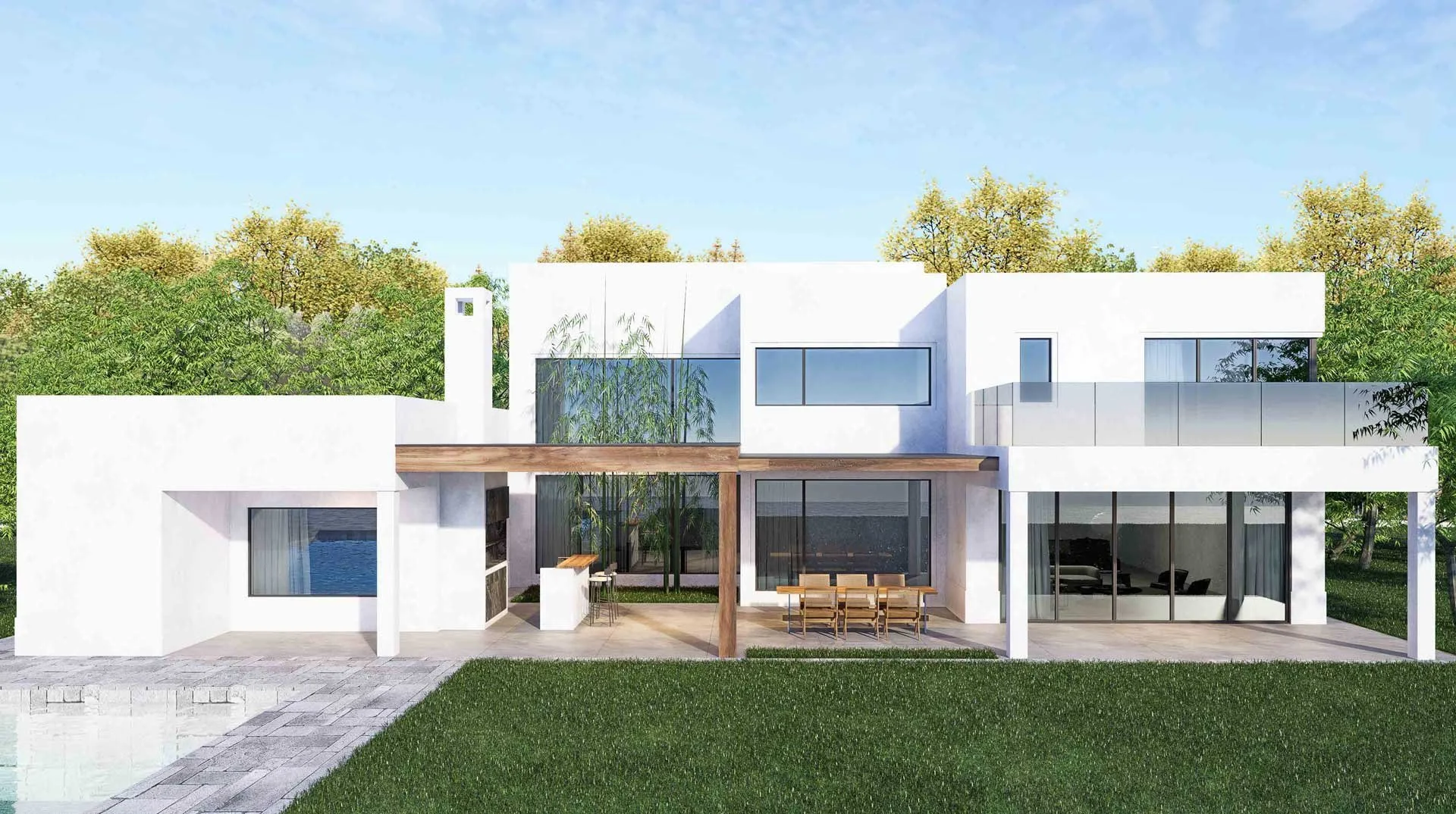 Modern white house with large glass windows and outdoor patio, surrounded by green grass and trees, under a blue sky.