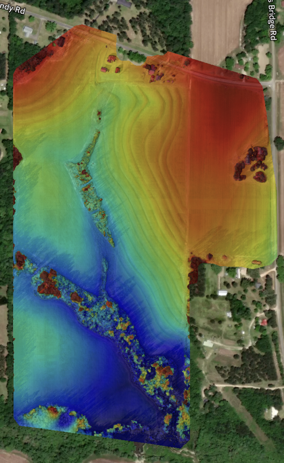 Elevation surface visualization highlighting terrain variation and drainage patterns across the site.