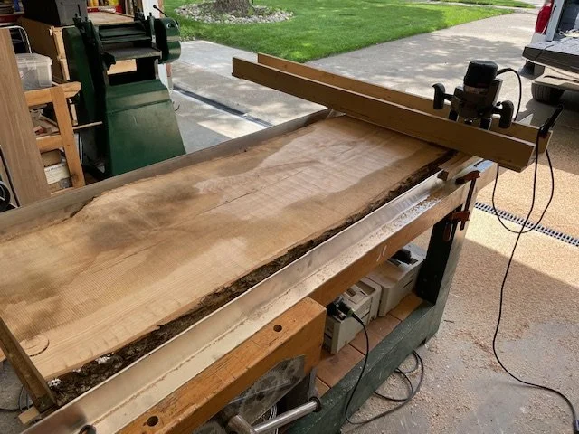 Flattening the solid live edge ash desk top. 
