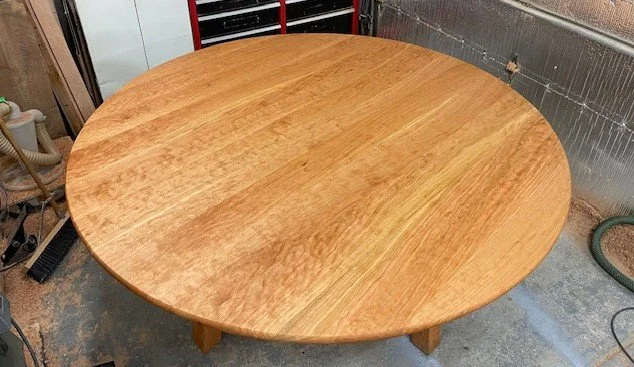Large handcrafted round solid cherry dining table. 