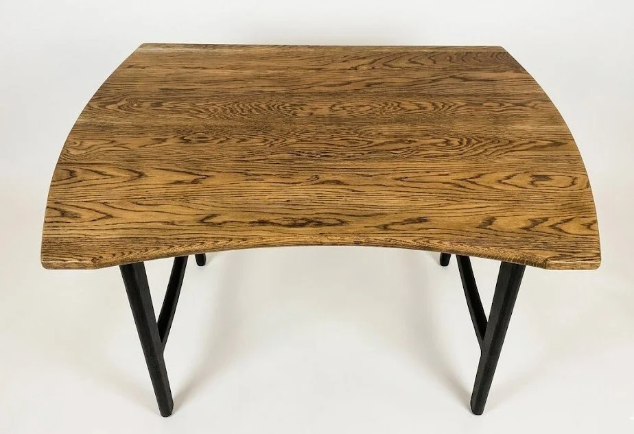 curved-oak-desk-with-black-grain-accents.jpg