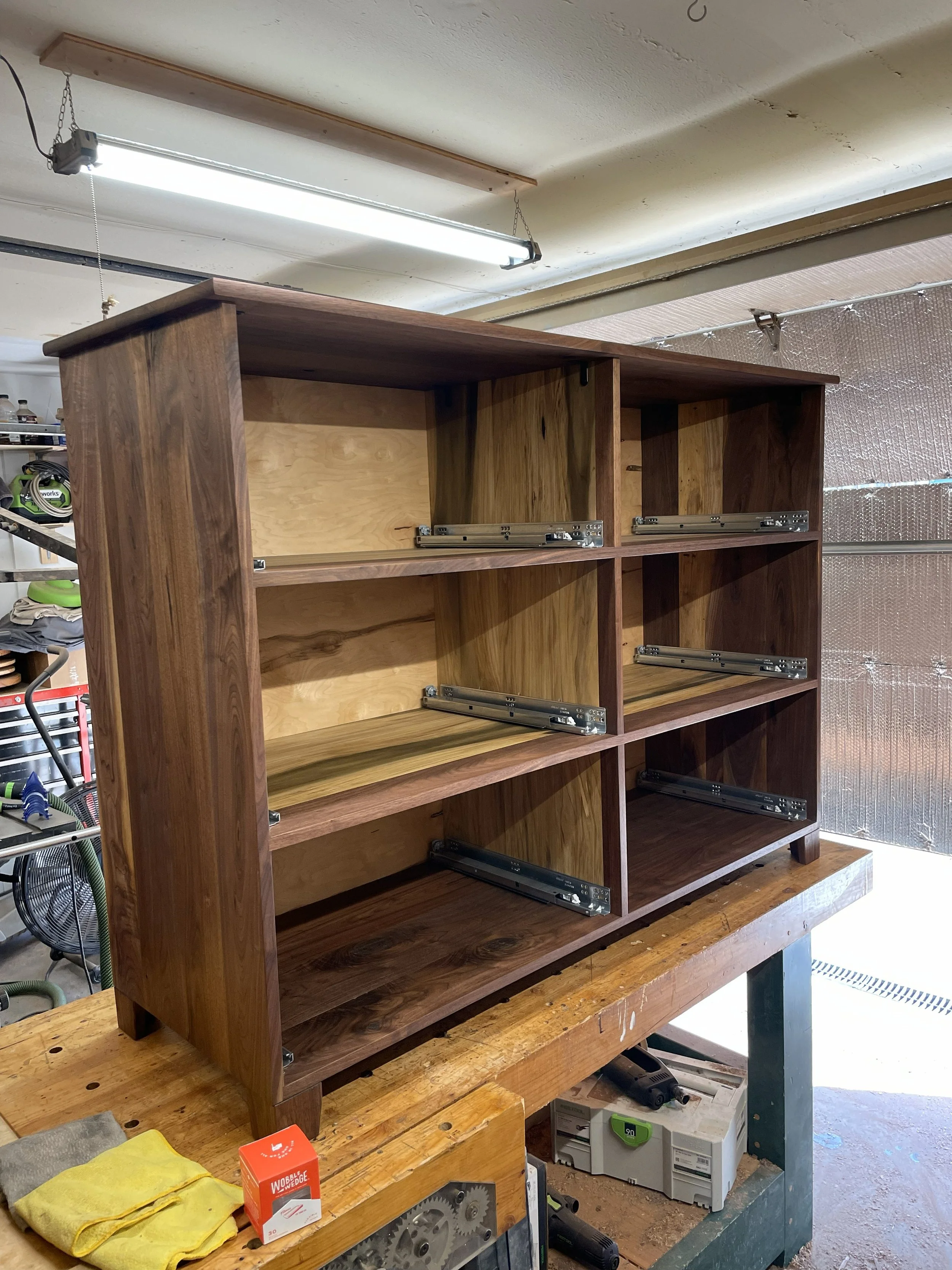 Modern handcrafted solid walnut wood dresser case with soft close undermount drawer slides. 