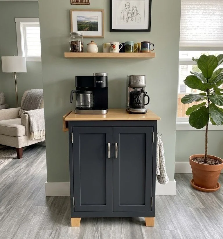 Free-standing coffee bar cabinet with natural wood top and painted base.