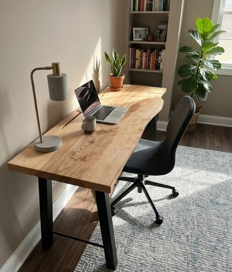 Handcrafted live edge ash desk with metal legs, close-to-the-wood hand rubbed finish, and integrated cable management. 