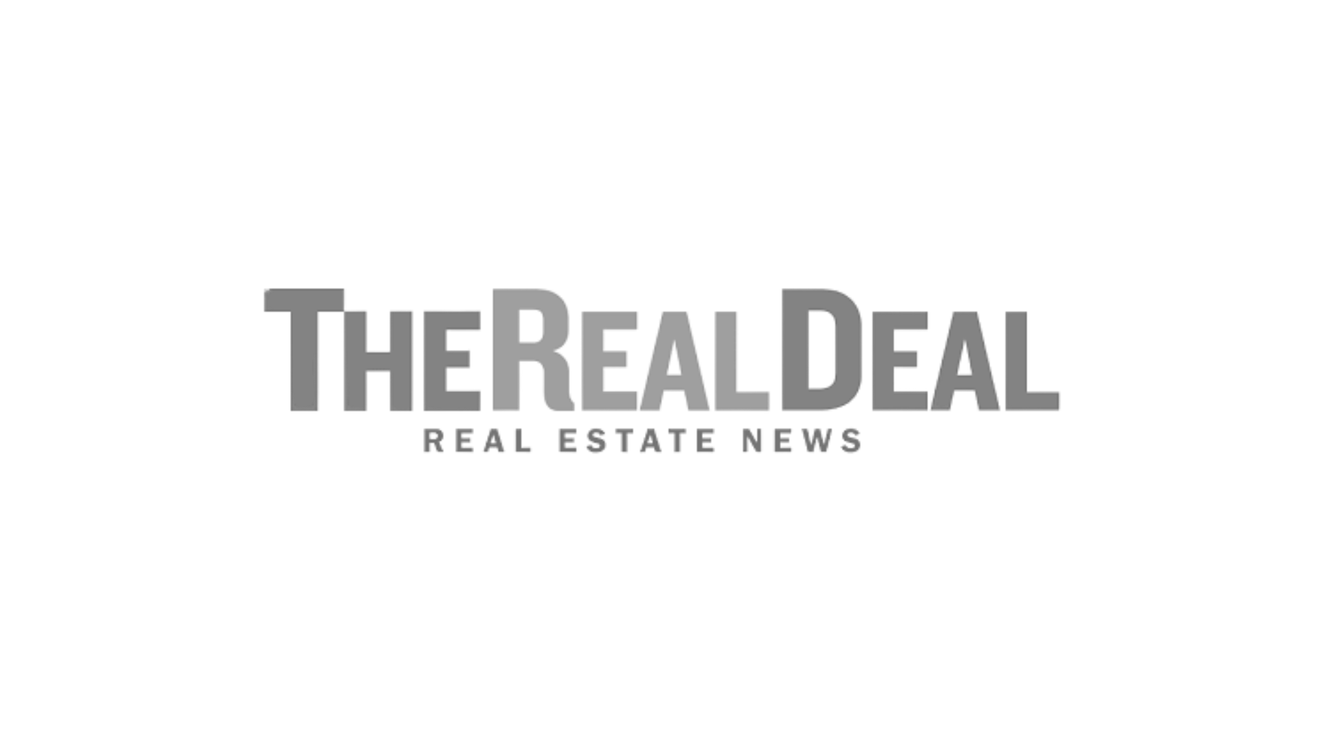 Sign that reads 'The Real Deal' with 3D block letters, black background.