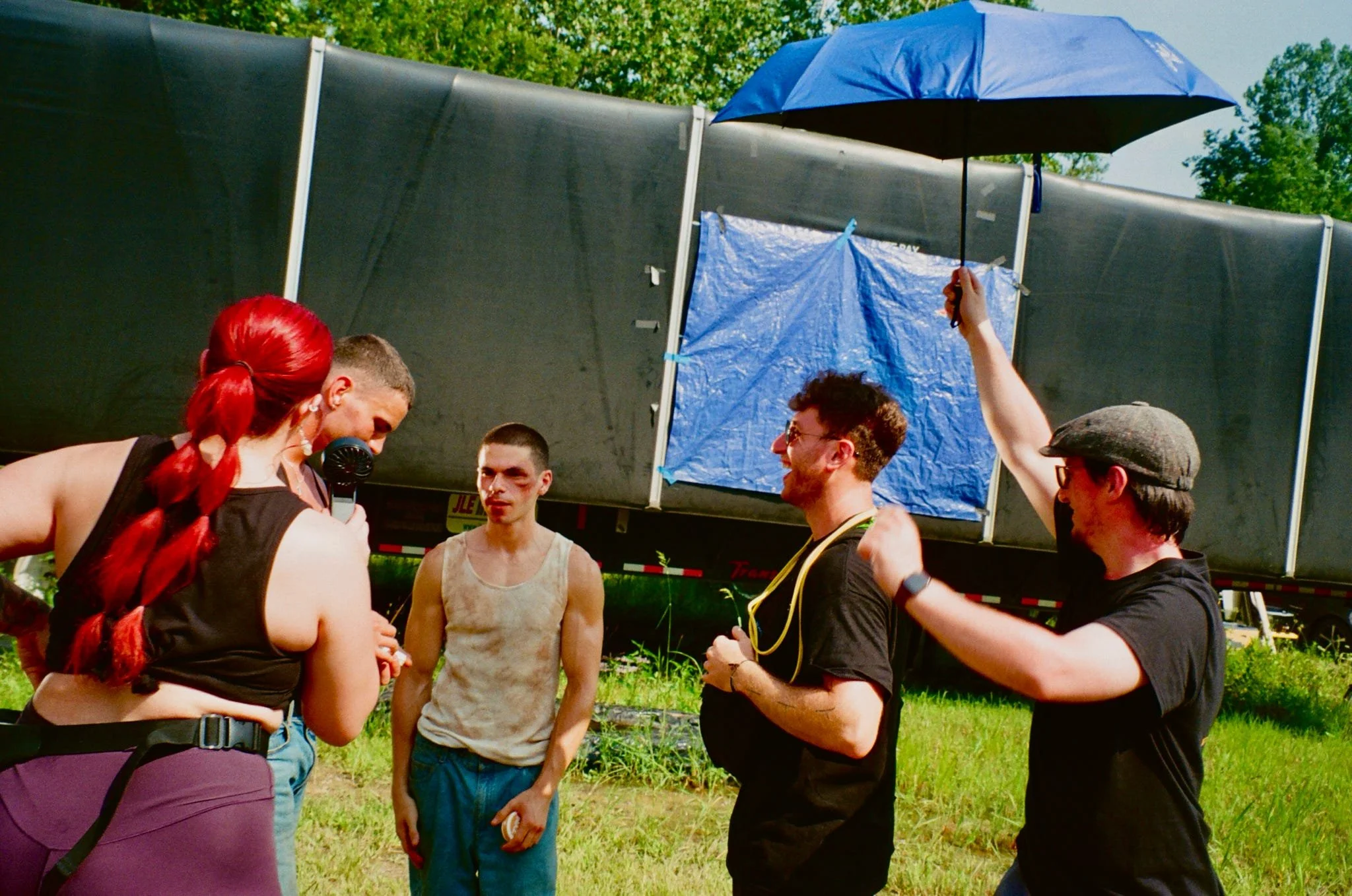 Crew Members and Actors receiving some much-needed shade.