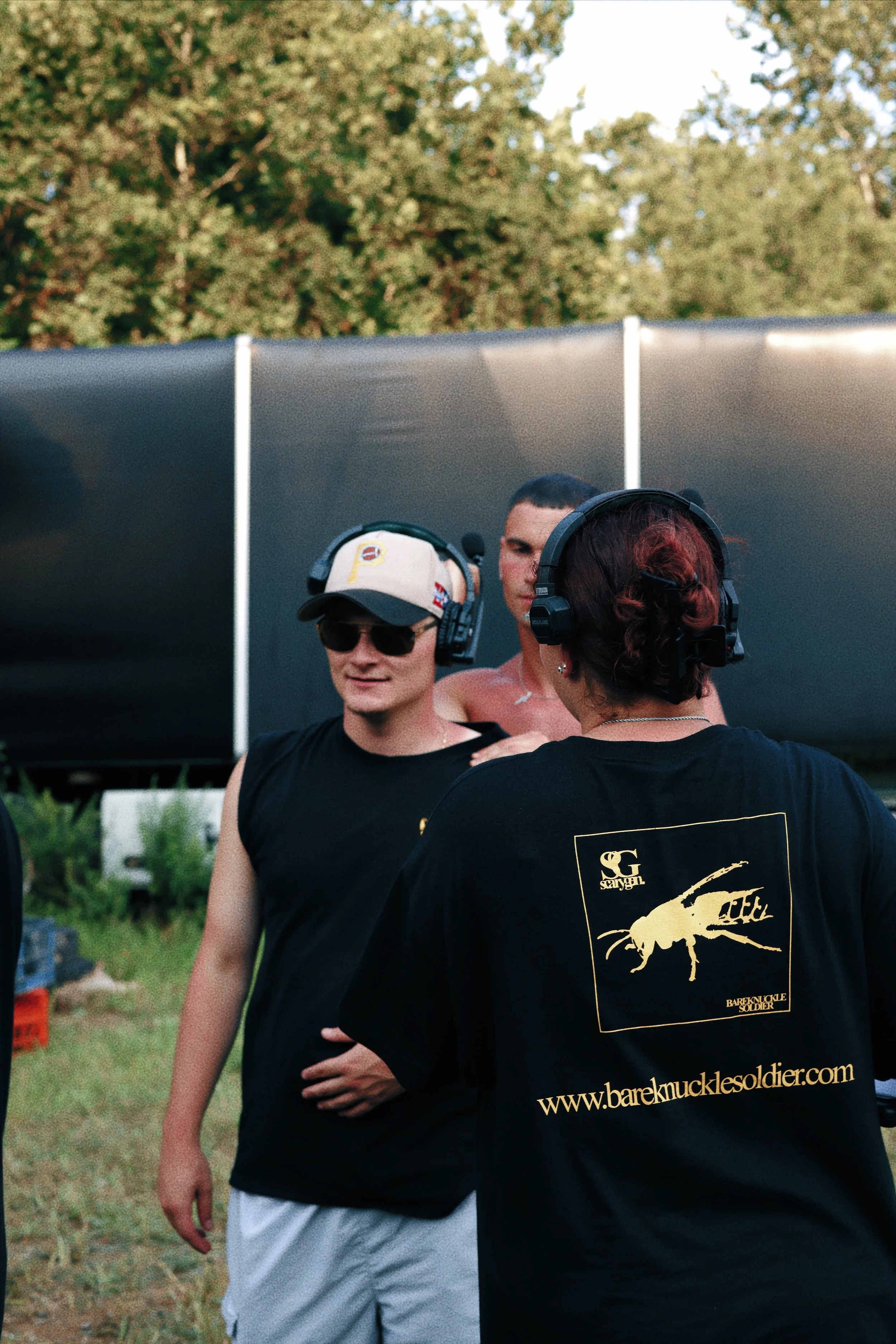 Director Constantine Kontos receiving a massage from actor Elijah Santoro in-between takes. 