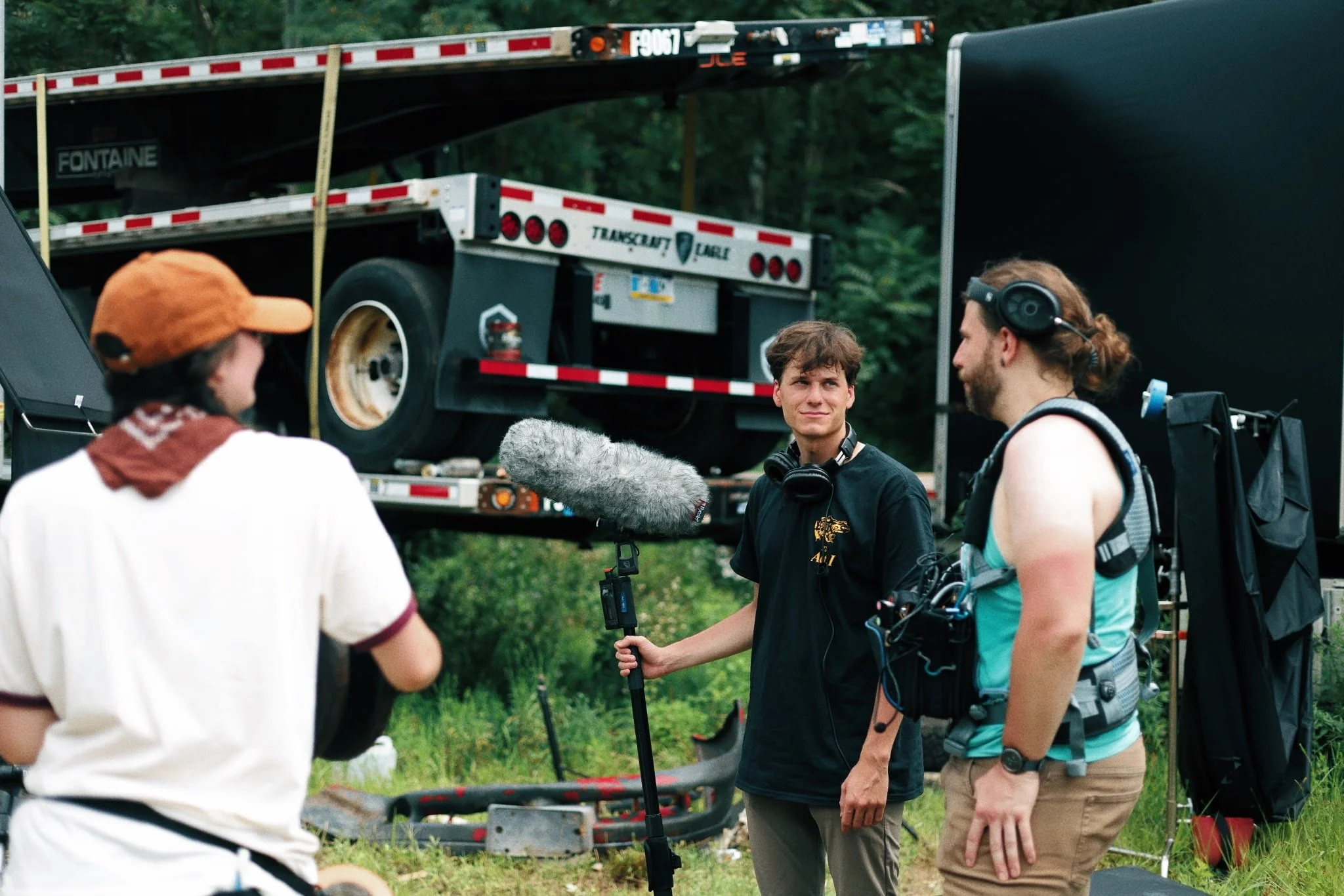 2nd AC Neveah Wessel (LEFT), Boom Operator Colin Fink (CENTER) & Production Sound Mixer Steven Croner (RIGHT) conversing in-between takes. 