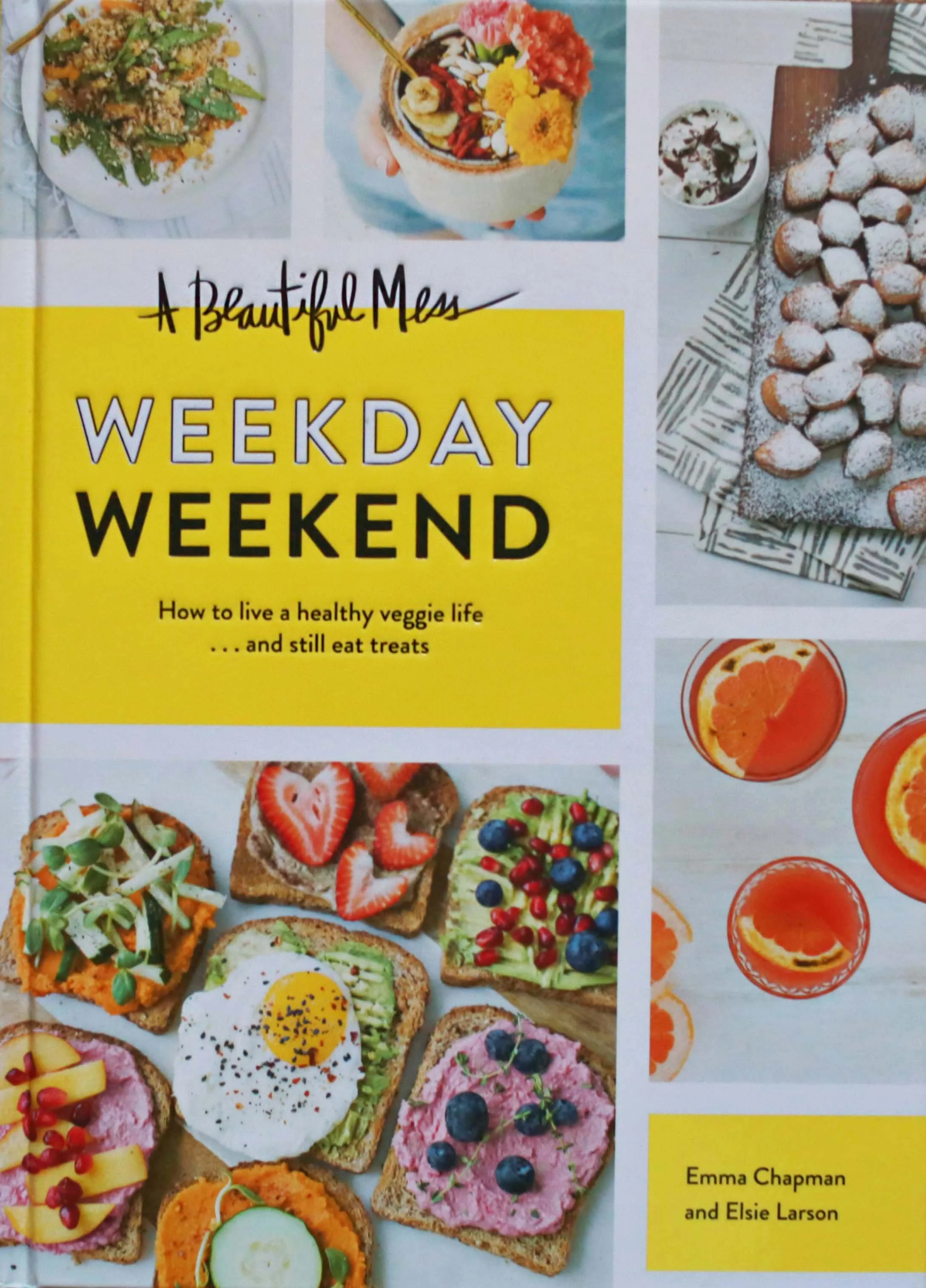 Cover of a book titled "A Beautiful Mess: Weekday Weekend" by Emma Chapman and Elsie Larson. The cover features images of colorful healthy snacks, desserts, and beverages, including toast with various toppings, a bowl of coconut-covered confections, and glasses of orange drinks.