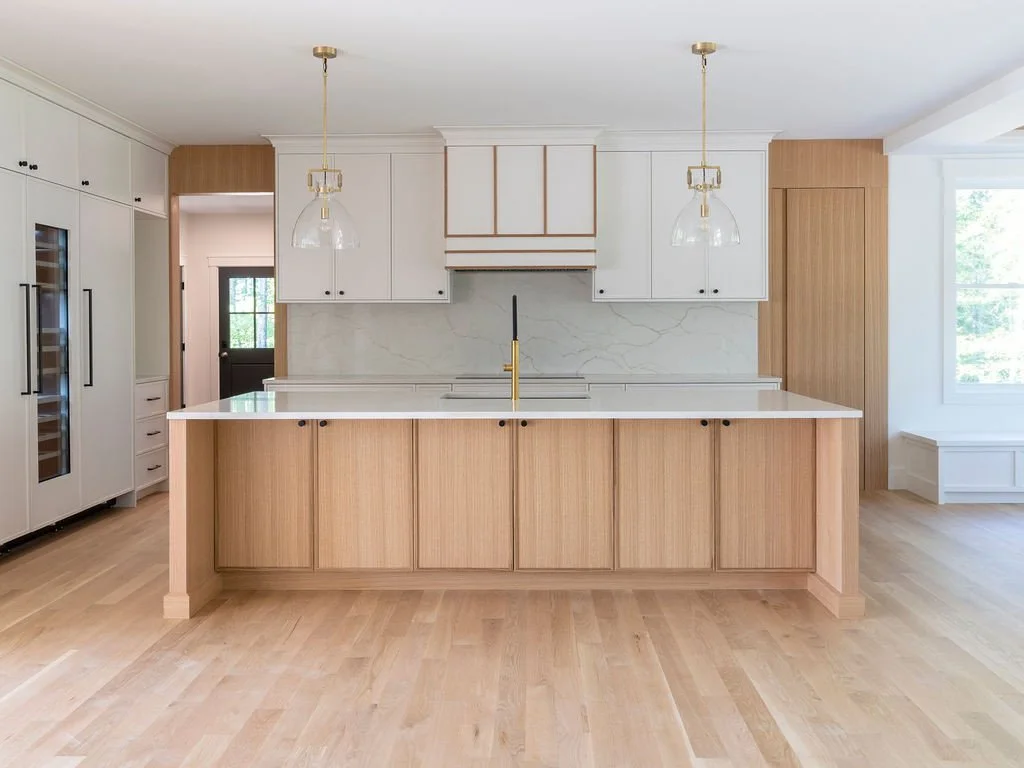 Designed for the way families gather and live.⁠
⁠
This open-concept kitchen balances warmth and simplicity with a layout that keeps everything connected &mdash; from cooking and conversation to everyday moments around the island. Natural wood cabinet