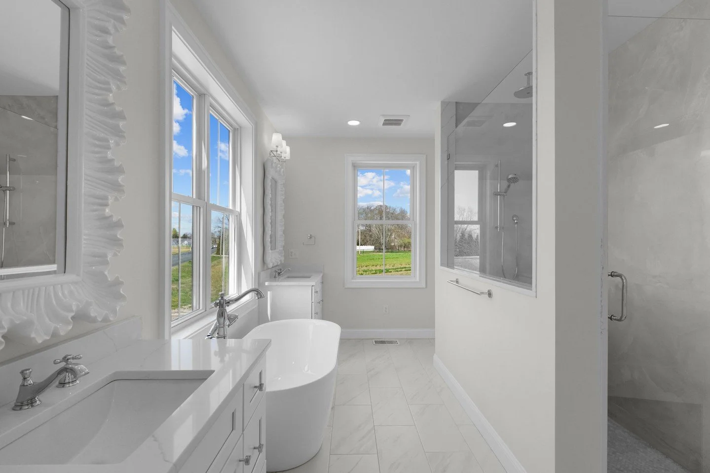 A balance of function, comfort, and retreat. The soaking tub is positioned to take in the views, paired with a spacious walk-in shower for a seamless, spa-like feel. Every detail was thoughtfully considered to create a space that feels calm, refined,