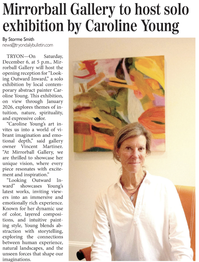 Caroline Young has short hair and is sitting in front of an abstract painting with warm colors like yellow, orange, and red, on a beige wall.
