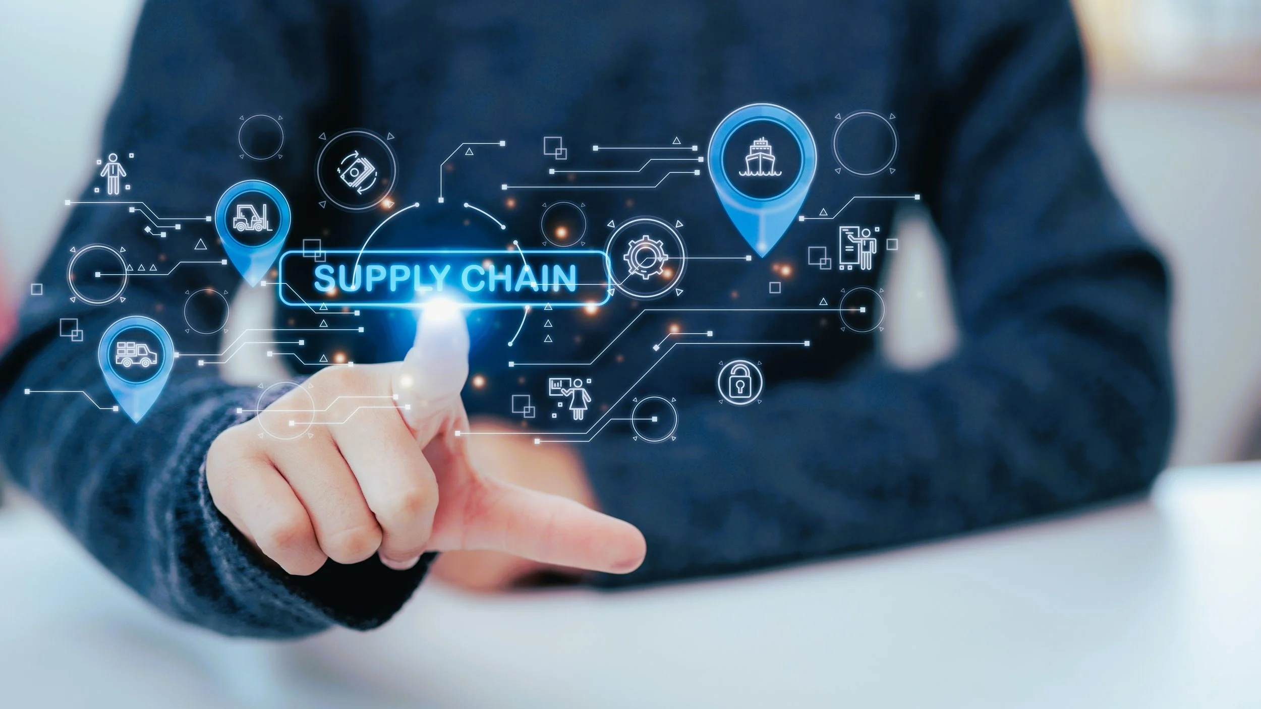 Person touching a virtual interface with the words 'SUPPLY CHAIN' and icons representing logistics and supply chain management.