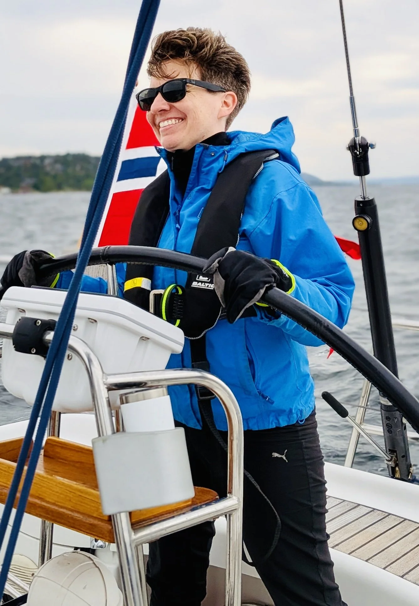 Beginner sailor at helm