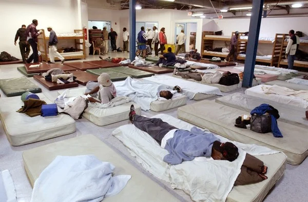 Men of the Lakeside Avenue homeless shelter in Cleveland are assigned sleeping bunks and mats in this 2002 file photo. The rights of the homeless in Ohio to stay on the voting rolls even without a fixed address, other than, sometimes, an intersectio…