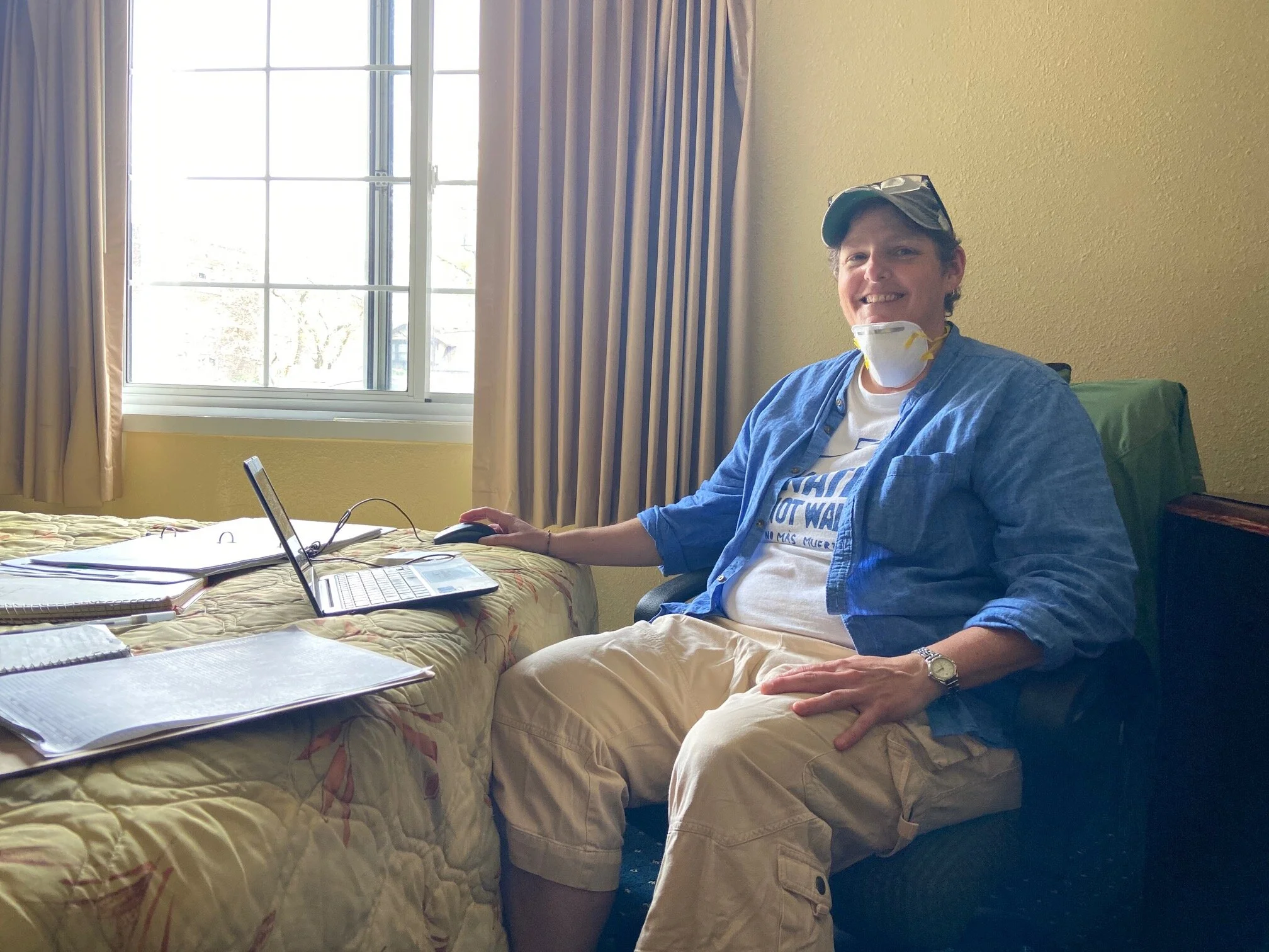 Paula Miller, who has been a Catholic Worker for two decades, uses a hotel room as her office as she coordinates hospitality and outreach efforts for about 50 unsheltered people staying at the hotel for Northeast Ohio Coalition for the Homeless.