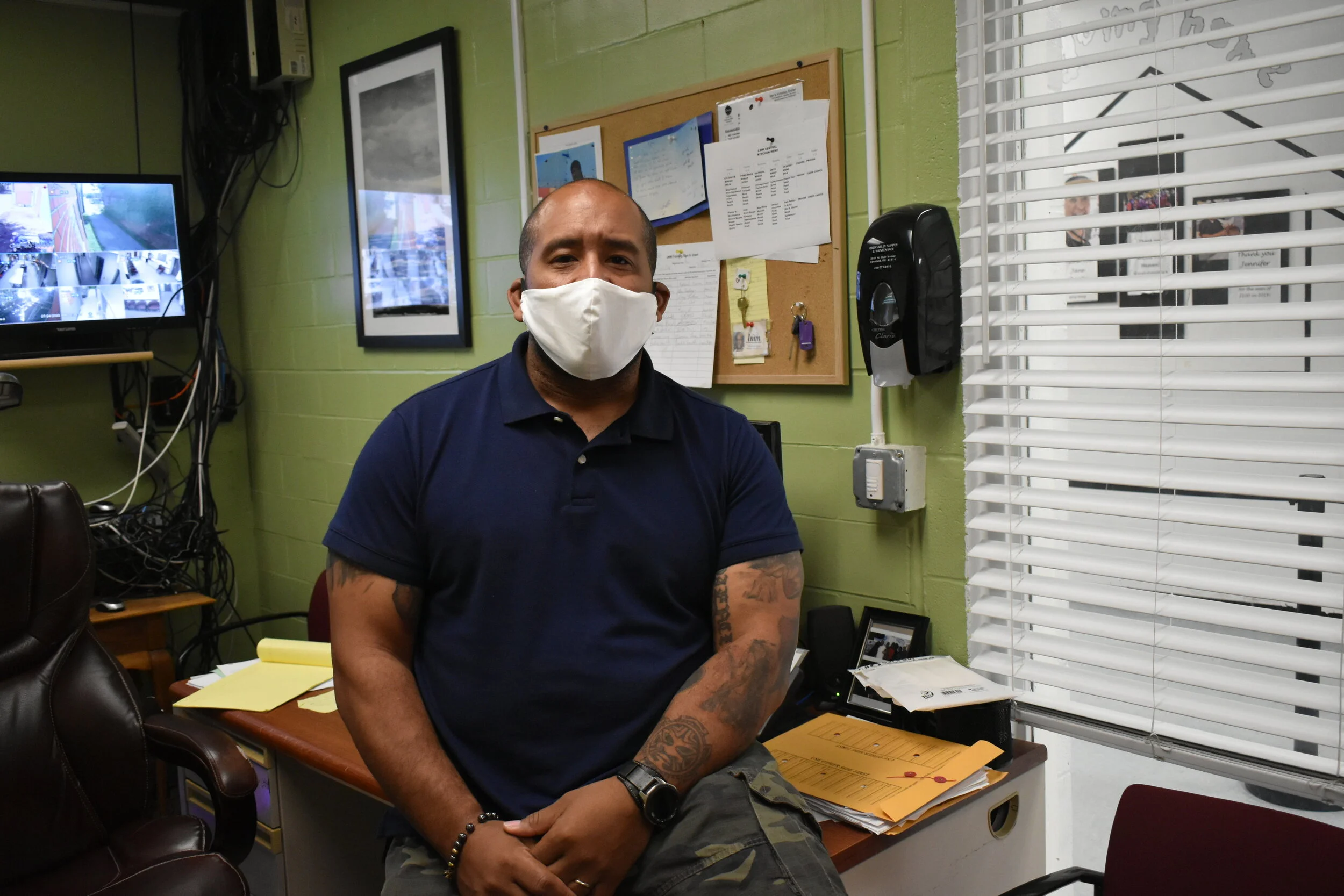 David Blunt, director of operations at Lutheran Metropolitan Ministry’s men’s shelter, sits at his desk at the homeless shelter at 2100 Lakeside Avenue in Cleveland. Photo by Conor Morris