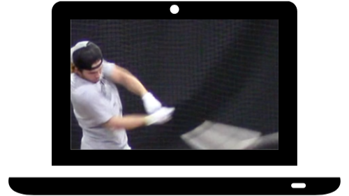 Person practicing golf indoors with hitting mat and net