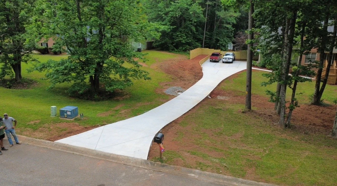 Concrete driveway installation completed to improve property access, functionality, and curb appeal for a residential property in Newnan, Georgia.
