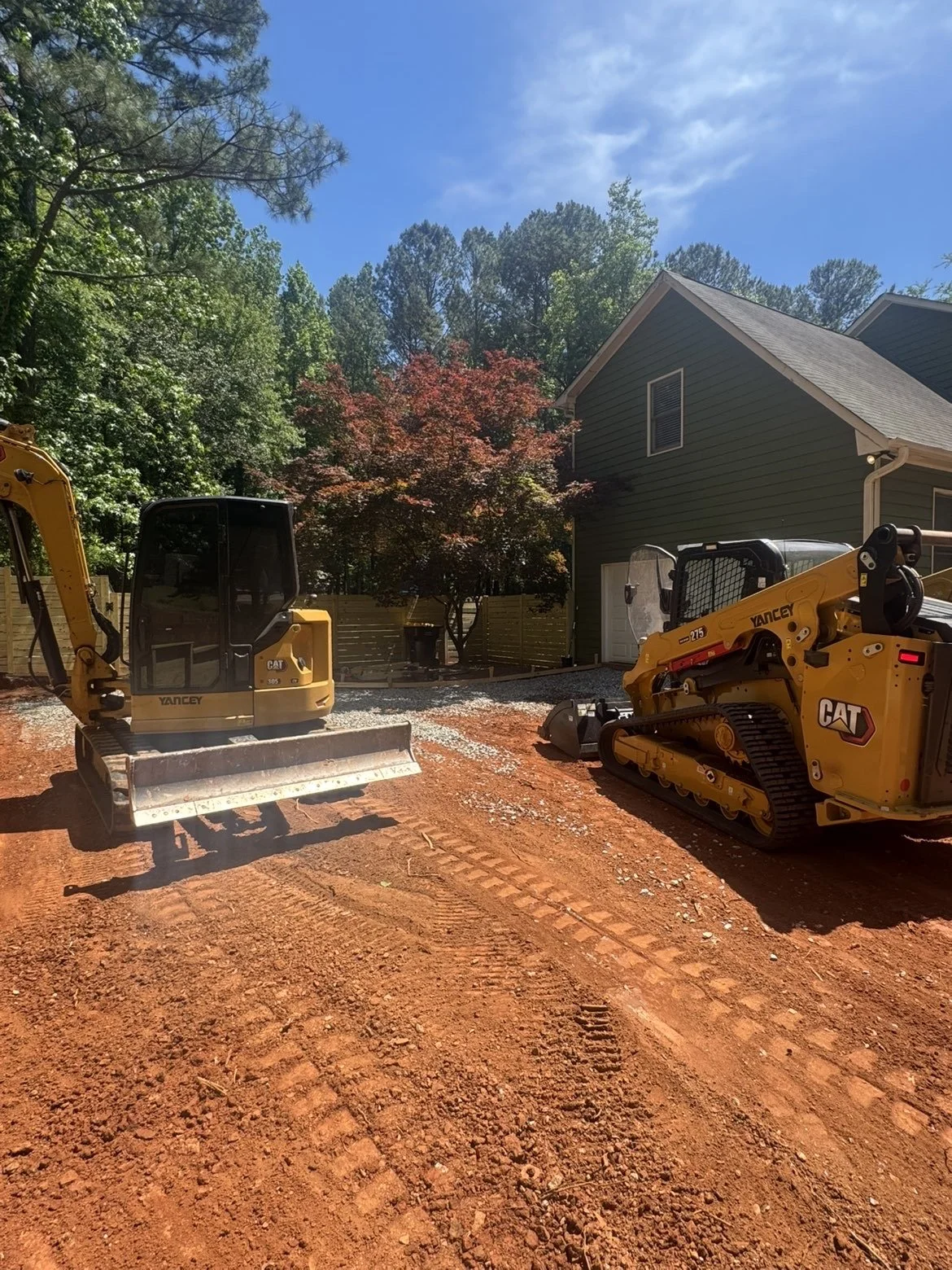 Excavation and site preparation services completed with CAT compact excavators for a residential property improvement project in Middle Georgia.