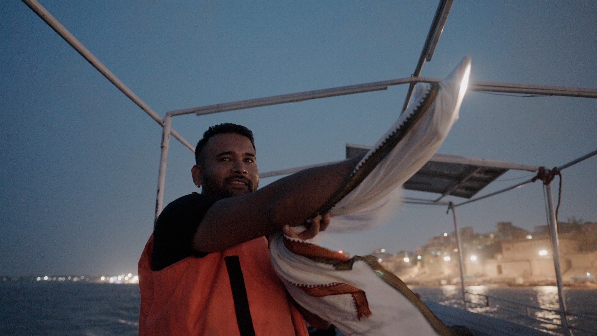 Camera assistant holding makeshift light for famdocs shoot