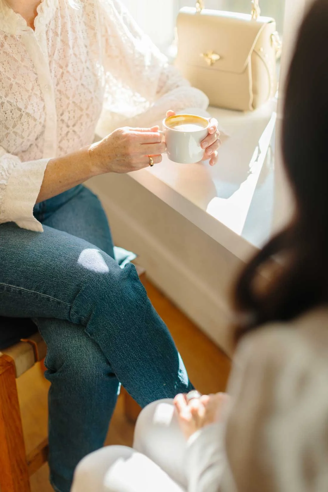 San Francisco psychologist Stephanie Rooney in conversation with a client over coffee.