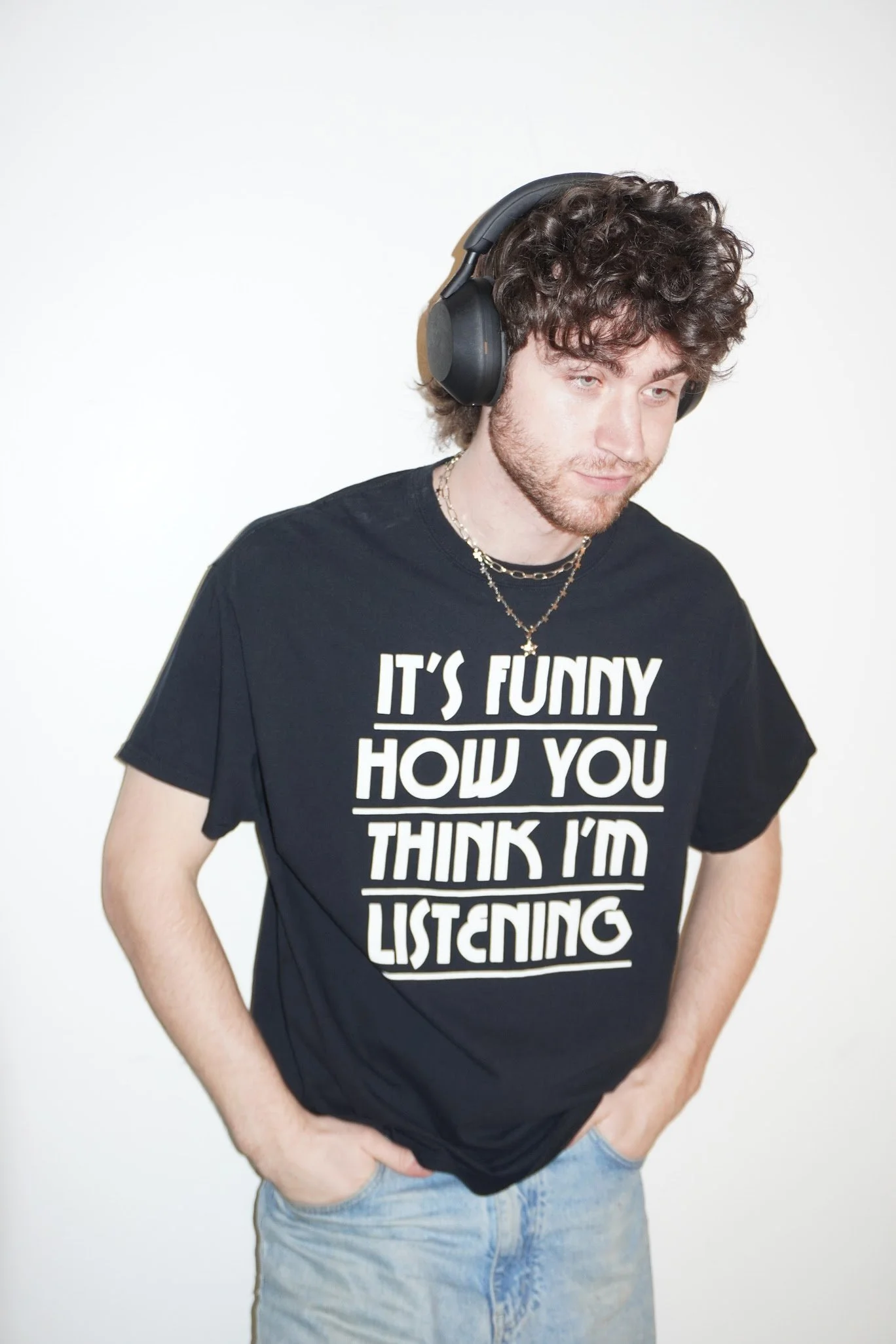 it's funny how you think i'm listening' black novelty tee
