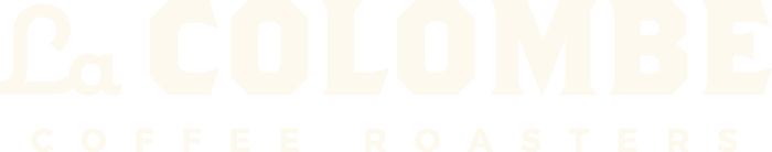 Text of a logo reading "La Colombia Coffee Roasters" in bold white letters on a black background.