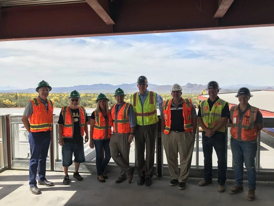 CEO Russel Fererico and team conducting an on site safety walk through in safety vests and hard hats