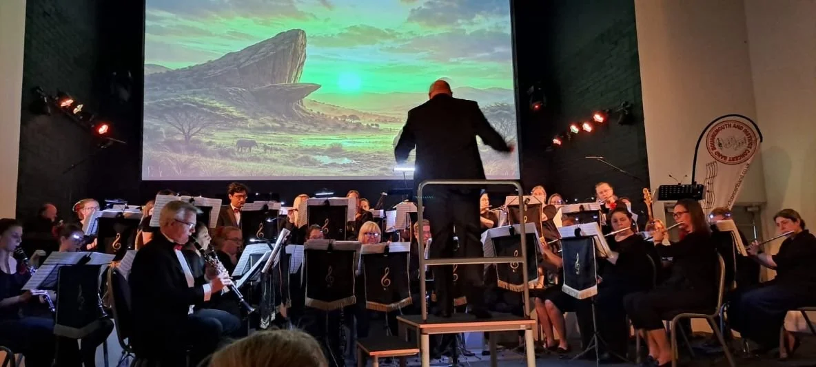 Band performing musicals concert on stage