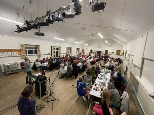 Hall filled with people for virtual horse racing night