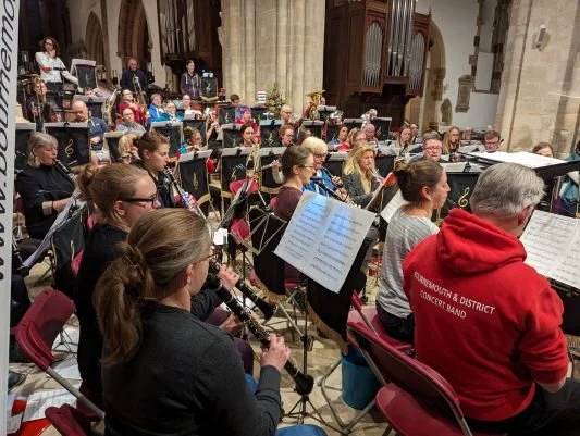 Band members rehearsing at Wimborne Minster