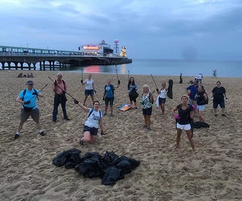 Band members brave Bournemouth beach clean dodging storm!