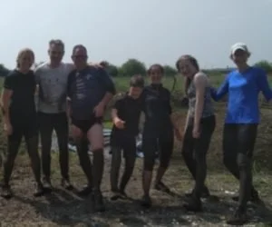 Band members running the Wimborne and Ferndown 5K Muddy Fun Run
