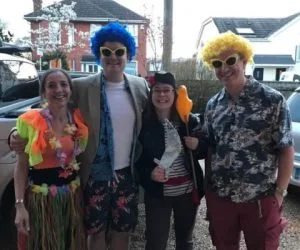 Band members in beach-themed fancy dress