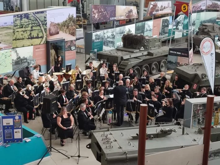 Band members performing in the Tank Museum