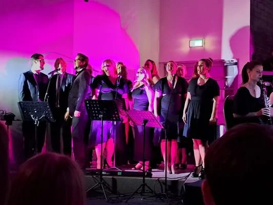 BMT Productions singing on stage