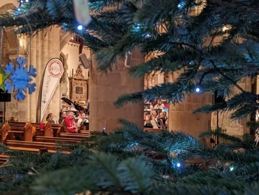 Band rehearsal at Wimborne Minster with Christmas tree in foreground
