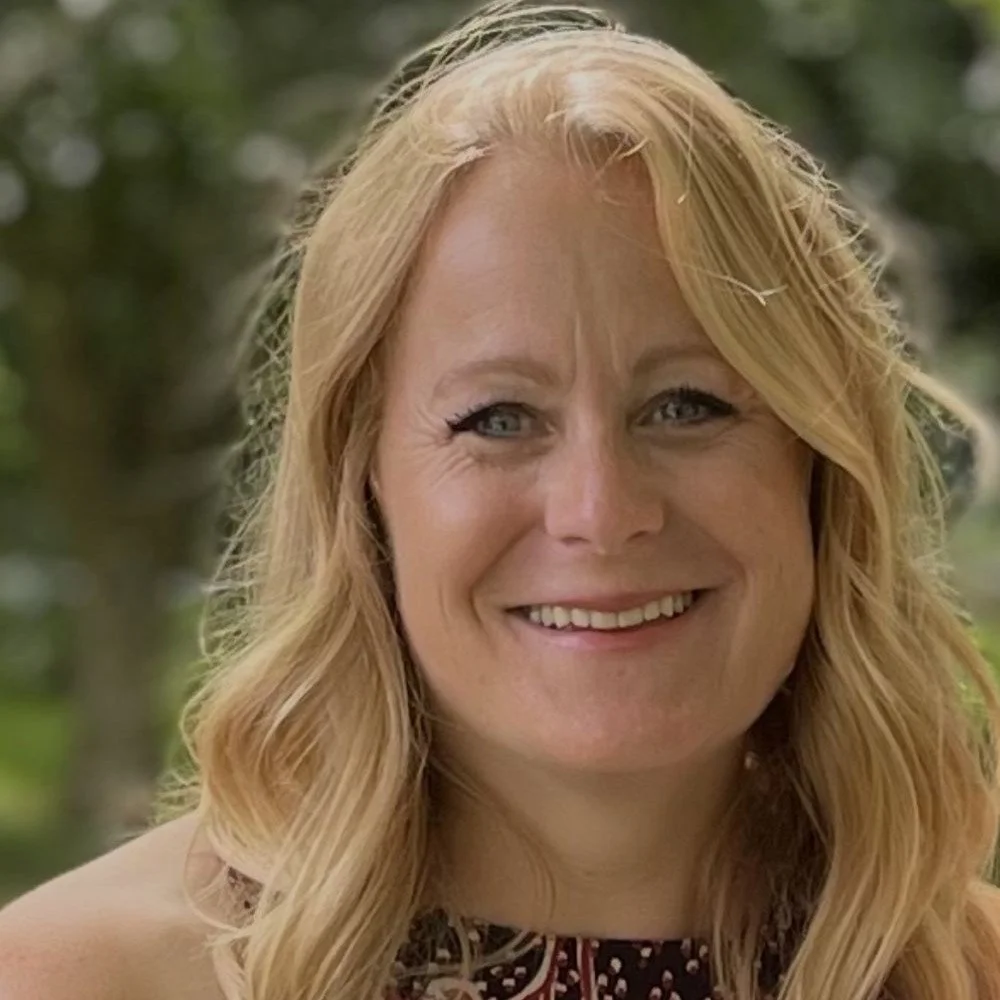 Profile of smiling woman Tracey with long blonde hair