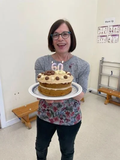 Woman holding birthday cake