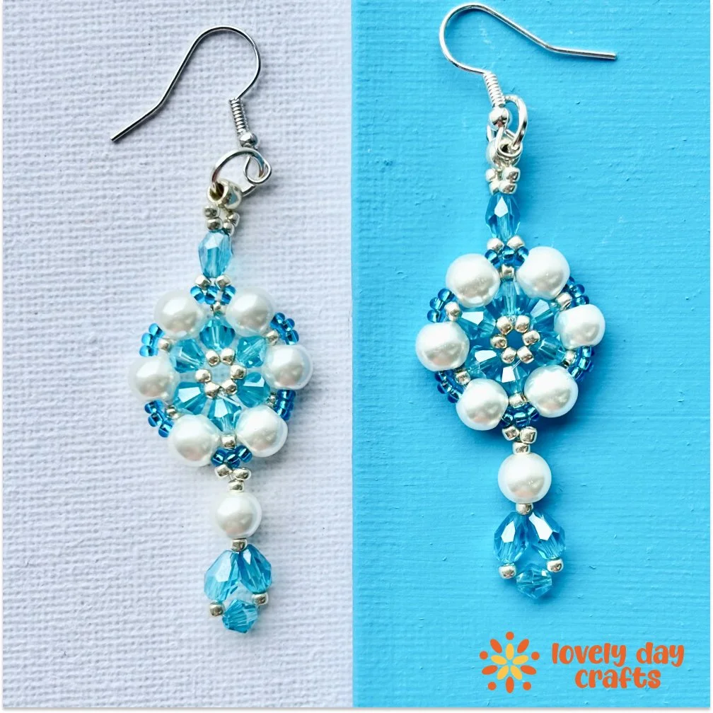 White and blue beaded adriana earrings on white and blue background, made by lovelydaycrafts